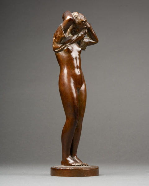 Maurice DELANNOY (1885-1972) 'Jeune femme se dénudant' Bronze patiné, période Art Déco.