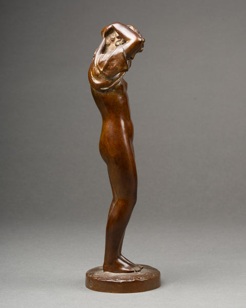Maurice DELANNOY (1885-1972) 'Jeune femme se dénudant' Bronze patiné, période Art Déco.
