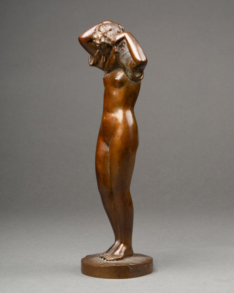 Maurice DELANNOY (1885-1972) 'Jeune femme se dénudant' Bronze patiné, période Art Déco.