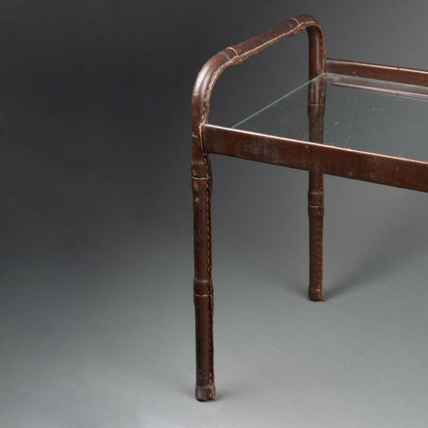 Jacques ADNET (1900-1984) Small brown topstitched saddle leather coffee table and glass top, Circa 1950