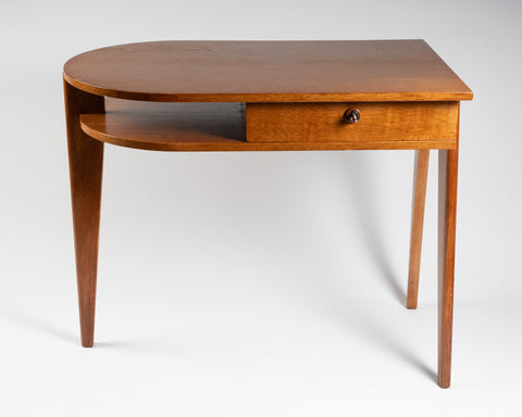 Jacques ADNET (1900-1984) Small oak tripod desk with sliding drawer