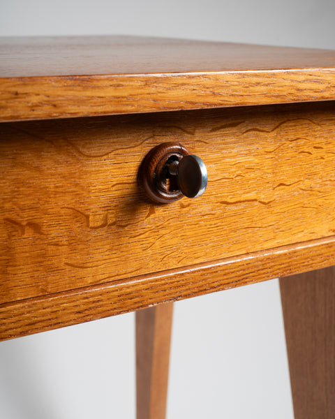 Jacques ADNET (1900-1984) Small oak tripod desk with sliding drawer