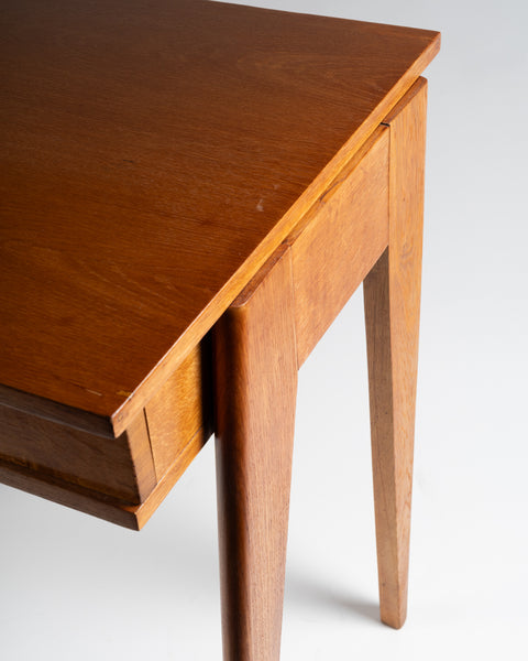 Jacques ADNET (1900-1984) Small oak tripod desk with sliding drawer