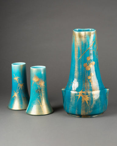 Clément MASSIER et L. LEVY - Bel ensemble de 3 vases en céramique émaillée sur fonds bleu, décor à l'or.