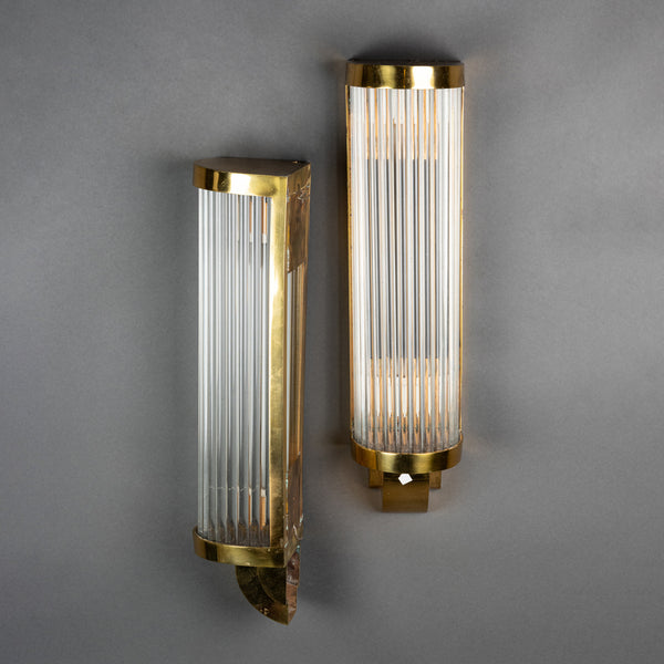 Pair of Art Deco wall sconces with golden metal bases and glass tubes