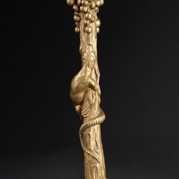 Pair of gilded bronze candlesticks, decorated with lizards, lions, and bunches of grapes, late 19th century.