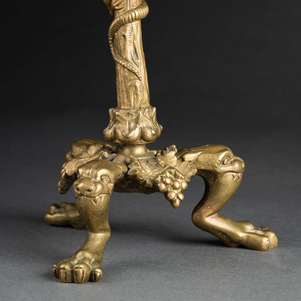 Pair of gilded bronze candlesticks, decorated with lizards, lions, and bunches of grapes, late 19th century.