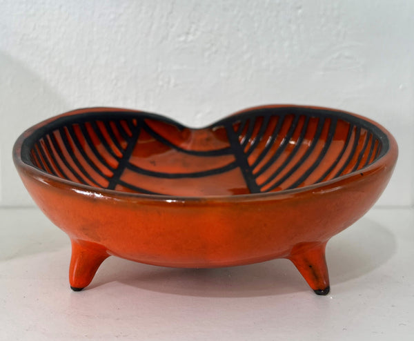 Roger CAPRON - Red enameled ceramic tripod bowl with black striped decoration. Circa 1950