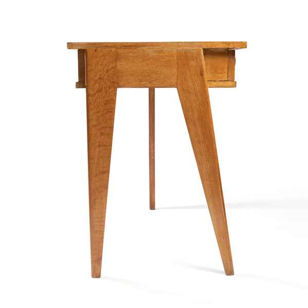 Jacques ADNET (1900-1984) Small oak tripod desk with sliding drawer.